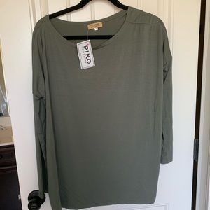 Long sleeve Piko top. New with tags